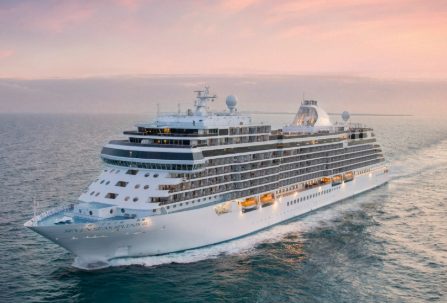 Large cruise ship sailing on the ocean at sunset